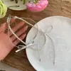 Collar de perlas con lazo de doble capa de primavera, accesorio para mujer, cadena de clavícula de nicho de lujo ligero, collar gargantilla de alta calidad