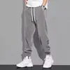 Calças casuais masculinas, coleção primavera/outono, estilo americano, estilosas e descoladas, tricô pesado, calça de moletom com perna afunilada, corte solto, cintura com cordão, calça esportiva versátil