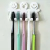 Suporte de escova de dentes com ventosa de desenho animado transfronteiriço para família de três suporte de escova de dentes com sorriso fofo para pessoas pequenas suporte de escova de dentes pendurado/suporte de escova de dentes
