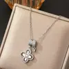 Novo Colar de Trevo de Quatro Folhas Estilo Coreano com Zircônia Microincrustada em Aço Titânio para Mulheres, Banhado a Cobre com Ouro Real, Corrente de Clavícula Tendência