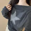 Top de punto casual coreano holgado para mujer, de un solo hombro, manga larga, con estampado de estrellas