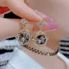 Pendientes de circonita con diseño único de nicho de lujo ligero, moda de personalidad, pendientes de circonita enrollados, pendientes de cruz de microdiamantes, pendientes de cristal gris