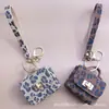 Llavero de Bolso Retro Francés Pu Estampado Leopardo Bolso Mini Portátil Moda Colgante Cabeza de Bolso Bolso para Auriculares Billetera