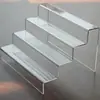 Estante de Almacenamiento Multicapa de Acrílico con Exhibición Tipo Escalera para Figuras, Cajas Sorpresa y Almacenamiento y Exhibición de Cosméticos