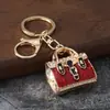 Llavero de aleación creativa transfronterizo europeo y americano con diamantes de imitación y esmalte de color, colgante para bolso con estampado de leopardo, accesorio de moda, regalo