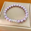 Pulseira redonda elástica de pérolas com contas cravejadas de zircônia, toque de luxo leve de nicho de alta qualidade, acessório de mão estiloso e versátil