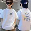 Camiseta Versátil de Manga Corta 100% Algodón para Niños 2026 Artículo Caliente de Verano Niños Cuello Redondo Tops Casuales Para Niños Pequeños y Medianos Moda T