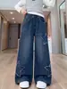 Pantalones de Mezclilla para Niñas con Estrellas de Borde Crudo Aplicadas Otoño 2026 Nuevas Llegadas Niños Medianos y Grandes Pantalones Versátiles de Pierna Ancha Pantalones Rectos Pantalones
