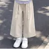 Conjunto de moda primavera e outono para meninas: um top estiloso com lapela e design patchwork, criando um visual de duas peças falsas, combinado com calças casuais versáteis e da moda - um conjunto de duas peças