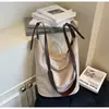 Bolsa Saco Fashion Retrô Temperamento Feminina 2026 Outono Nova Versátil Tote Bag Grande Capacidade Ombro Único Transversal Pequena