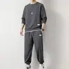 Traje deportivo casual para hombre otoño e invierno marca de moda con un conjunto de ropa guapa gofrado manga larga pantalones combinables para hombre