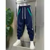 Nuevos pantalones casuales de otoño para hombre, forrados de polar y engrosados, corte slim, con paneles, elásticos, versátiles, pantalones rectos holgados