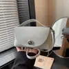 Mini Bolso de Hombro de Cuero para Mujer 2026 Nuevo Bolso Cruzado Simple Bolso Pequeño Color Sólido Bolso de Mano Versátil Bolso de Axila