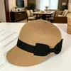 Gorra de béisbol popular de paja negra con lazo para primavera y verano para mujer, adecuada para la playa, vacaciones junto al mar, actividades ecuestres y protección solar