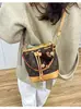 Bolsa pequena versátil transfronteiriça 2026 novo modelo bolsa feminina vintage, bolsa de mão com cordão de luxo leve, bolsa saco, bolsa pequena de ombro e transversal