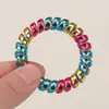 Comercio exterior clásico color arcoíris color metal línea telefónica Anillo para el pelo banda elástica moda pulsera grande no daña la base del pelo cuerda para el pelo