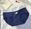 Calcinha feminina de algodão puro com blocos de cor fofa 2026 novo modelo cintura média 100% algodão entrepernas estendido respirável que cobre o quadril calcinha para jovem