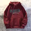 Moletom com capuz estampado de letras minimalista estilo americano para homens, novo modelo outono e inverno 2026, blusa hoodie casual solta oversized