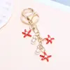Llavero de Estrella de Mar Colorida Transfronteriza Europea y Americana Moda Colgante de Perla de Imitación Colgante para Bolso de Niña Colgante Creativo Personalizado