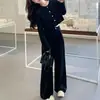 Conjunto de alta gama estilo coreano negro para mujer, nueva colección otoño 2026, con una chaqueta retro de cuello redondo y pantalones de pierna ancha, un conjunto de dos piezas