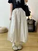 Vestido Midi 2025 Primavera Novo Casual Botão de Flor Balão Cor Sólida Cintura Marcada Versão Larga Saia Tendência Feminina
