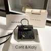 Bolso de mano de encaje de otoño e invierno generación 2025 nuevo nuevo mariposa china Kelly para el día a día al por mayor