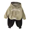 Nuevo Conjunto de Dos Piezas para Bebé Niño de Algodón con Capucha y Estampado de Letras, Sudadera Casual y Pantalones, Venta al por Mayor de Fábrica, Primavera y Otoño 2024