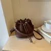 2026 Nova Moda Francesa Nicho Retrô Bolsa Saco com Cordão Bolsa de Ombro Transversal Simples de Alta Qualidade