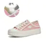 Zapatos de lona de dos vías para mujer, nuevo lanzamiento otoño 2026, zapatos planos casuales tipo galleta, zapatos blancos versátiles de moda, zapatos cómodos para mujer
