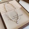 Collar de perlas de azúcar con temperamento retro francés, cadena para suéter de moda Joker de alto sentido, joyería simple de nicho al por mayor