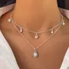 Collar Clavícula Retro Francés de Imitación Perla con Borla de Corazón de Tres Capas Apilable Europeo y Americano Nicho Temperamento de Gama Alta para Mujeres