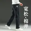 Pantalones largos de mezclilla azul para hombre, corte recto holgado, colección primavera/otoño/invierno 2026, pantalones casuales versátiles y modernos para hombre
