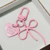 Chaveiro DIY Criativo Liga Recorte Laço com Coração Colorido Pingente Pendurado Coração de Menina Pingente de Bolsa
