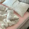 Juego de tres piezas de hilo de algodón de doble capa estilo Ins Una funda de almohada floral de gasa de algodón puro respetuosa con la piel un par de sábanas de color sólido