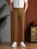 Pantalones casual de traje de alta gama para hombre de primavera, pantalones negros fluidos, corte recto versátil, sin arrugas, antiarrugas, lujo casual de negocios