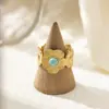 Anillo Tyna French de Oro de 18K Turquesa Acero Inoxidable para Mujer Apertura Cruzada de Alto Nivel Flor de Acero de Titanio