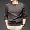 Suéter jacquard de cuello redondo transfronterizo para hombre, nuevo modelo de otoño 2026, color liso, capa interior casual simple, suéter de punto para hombre