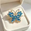 Broche de mariposa vintage europeo y americano con pedrería de colores, alfiler de aleación de lujo ligero incrustado, accesorio para abrigo y traje, accesorio para corsage