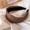 Faixa de cabeça retrô colorida com bolinhas e aba larga para mulheres, faixa de cabeça de esponja alta para pressão, acessório de cabelo versátil que faz o rosto parecer menor