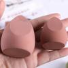 Los fabricantes venden al por mayor nuevos huevos de belleza, gotas de calabaza, borlas oblicuas para polvos, no comen huevos de maquillaje en polvo, secos y húmedos, de doble uso.