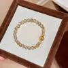 Pulseira Popular Xiaohongshu de Cristal Amarelo Natural Olho de Gato Escovado e Cristal com Fios Dourados para Mulheres, Pulseira de Contas de Moda de Nicho de Luxo Leve