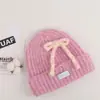 Gorro de lana tejido con lazo de cuerda colorido coreano para mujer, otoño e invierno, adelgazante, cálido, protector de orejas