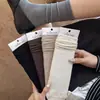Calcetines de otoño temprano e invierno para mujer, estilo retro francés, huecos, color liso, hasta la pantorrilla, sencillos, gruesos, versátiles, sin costuras, calcetines largos apilables