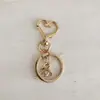 Fabricantes directos en stock suministro hebilla de estrella llavero de corazón juego de tres piezas gota de pegamento accesorios de yak forma especial