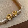 Pendientes de flor de ojo de gato de metal estilo francés para mujer, ligeros, lujosos, vintage, exquisitos, con diseño de nicho para otoño e invierno.