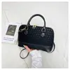 Bolsa Pequeña Mujer Primavera 2026 Nueva Moda Retro Portátil Bolso Concha Simple Casual Bolso de Hombro Cruzado Bolso de Mujer