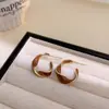 Pendientes de Tornillo Retorcidos Esmaltados con Goteo de Aceite Estilo Coreano Chapados en Oro Cobre para Mujer, Nuevos Pendientes de Botón de Moda Trendy de Lujo Ligero de Nicho con Temperamento