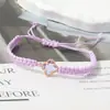 Pulsera tejida de nudo plano de trébol de cuatro hojas de venta caliente transfronteriza para parejas y estudiantes, tendencia europea y americana inspirada en la dopamina, joyería al por mayor de fabricante
