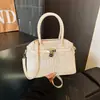 Bolsos de mano de alta gama para mujer, primavera 2026, nuevo estilo, bolsos versátiles, modernos, de nicho, texturizados, con bordado de letras, bolso de hombro
