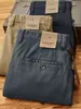 Nueva colección otoño e invierno 2026: forrados de polar, gruesos, texturizados, de sarga, elásticos, pantalones largos, de alta gama, corte holgado, pierna recta, pantalones casuales versátiles para hombre